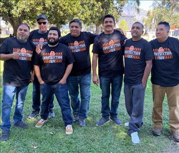 Group of male employees in construction t-shirts